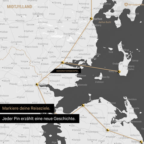 Detailed map of Denmark as a dark gray pinboard canvas, with travel destinations in Central Jutland marked with pins and a travel route depicted with string