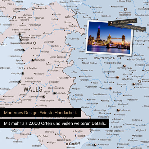 Detail of a political map of Wales and England in multicolor, an atlas with pins for marking visited destinations