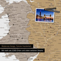 Close-up of a map of Wales and England in multicolor beige, with pins to mark visited destinations