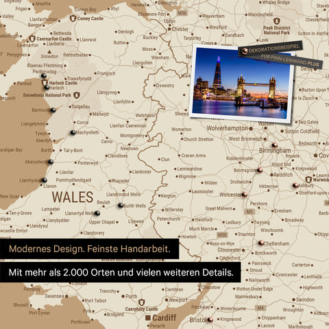 Close-up of a colorful map of Wales and England in Treasure Gold with pins marking visited travel destinations