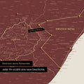 South Africa map in Bordeaux red color with pins and string marking travel destinations and the travel route in Lesotho and KwaZulu-Natal.