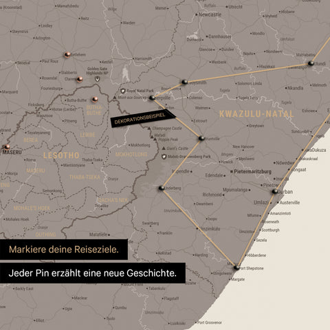 South Africa map in warm gray color (brown-gray) with pins and string marking travel destinations and the travel route in Lesotho and KwaZulu-Natal.