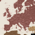 A detailed section of a multicolor matte world map pinboard shows a section of Europe with all countries and capitals.